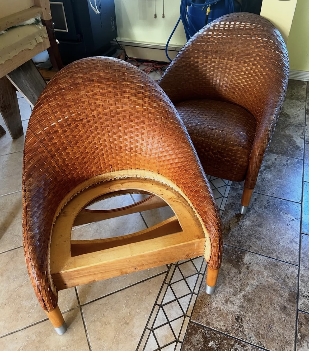 Stripped woven chair frame in the upholstery workshop, ready for restoration