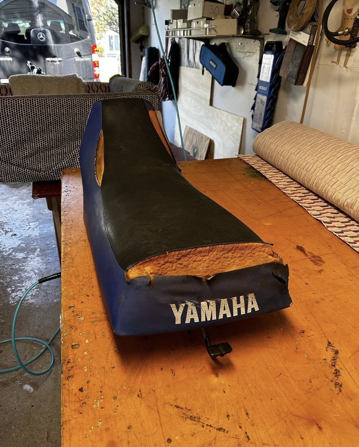 Yamaha Banshee ATV seat before restoration — torn and deteriorated original vinyl