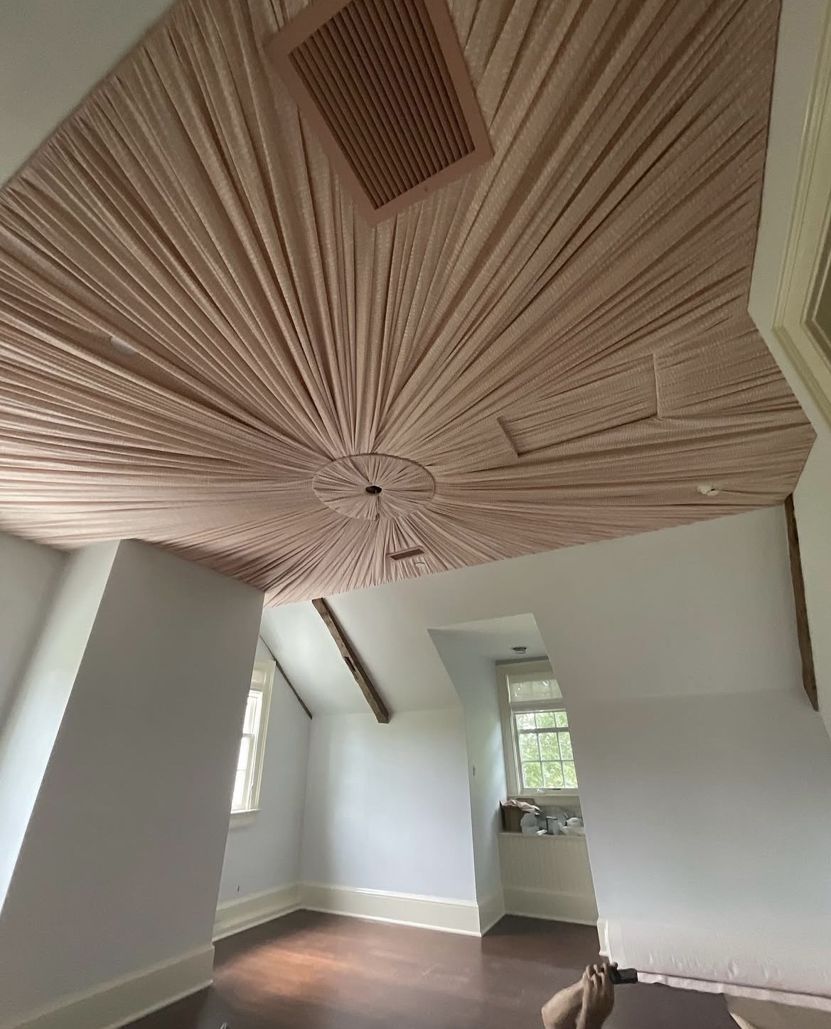 Radial pleated fabric ceiling — close-up of the sunburst pleating pattern