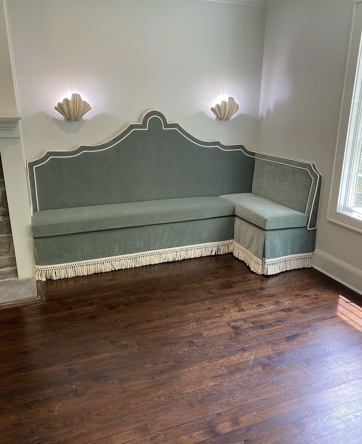 Finished built-in corner banquette installed in a residential room
