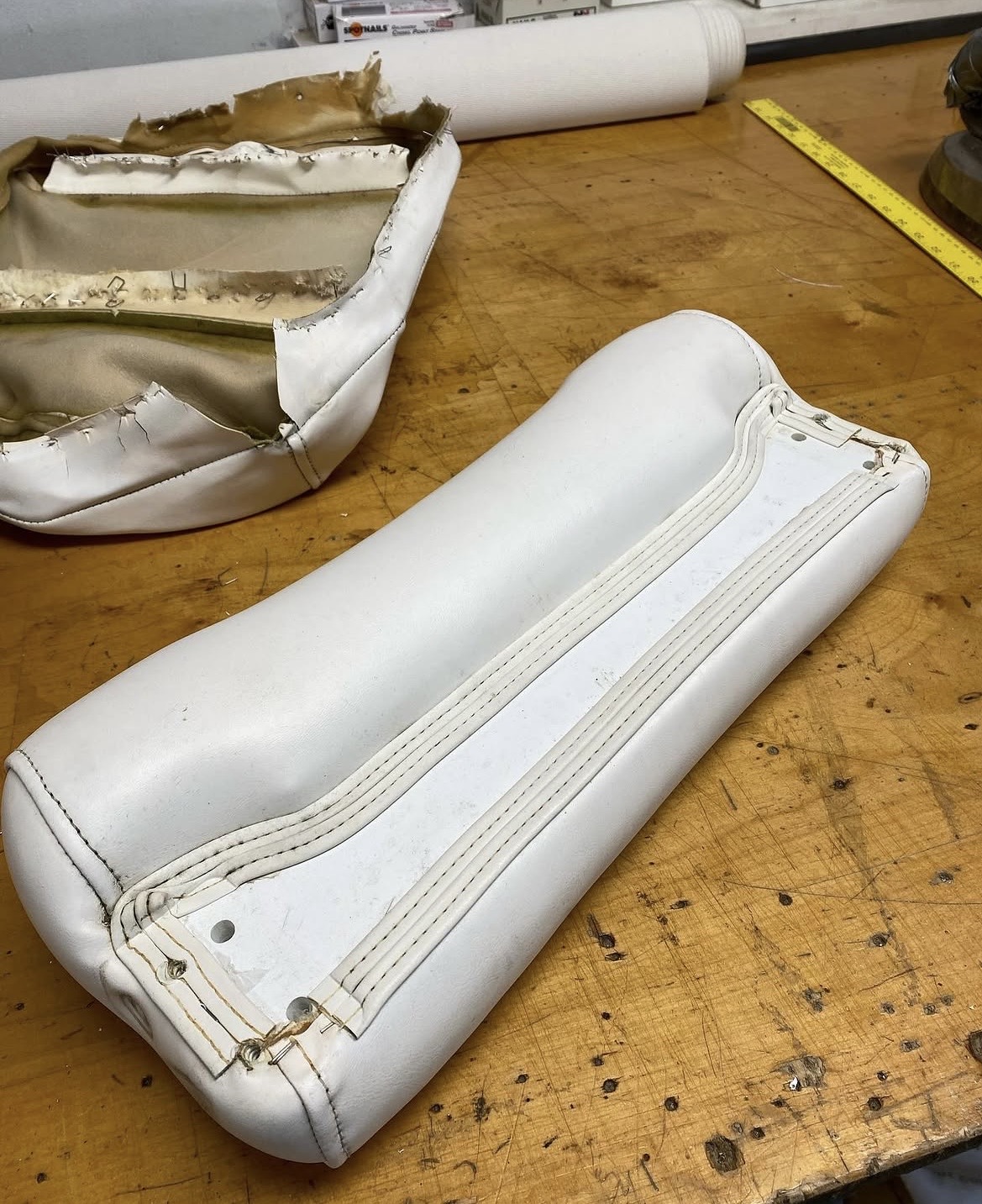 Boat seat cushion restoration — new white marine vinyl with double-needle stitching, Suffolk County NY