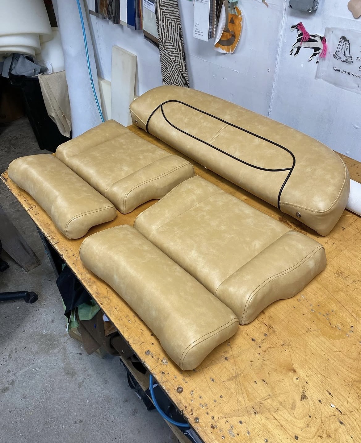 Complete marine cushion set — tan vinyl boat seating reupholstered at Fabricio's Upholstery Shop, Bellport Long Island