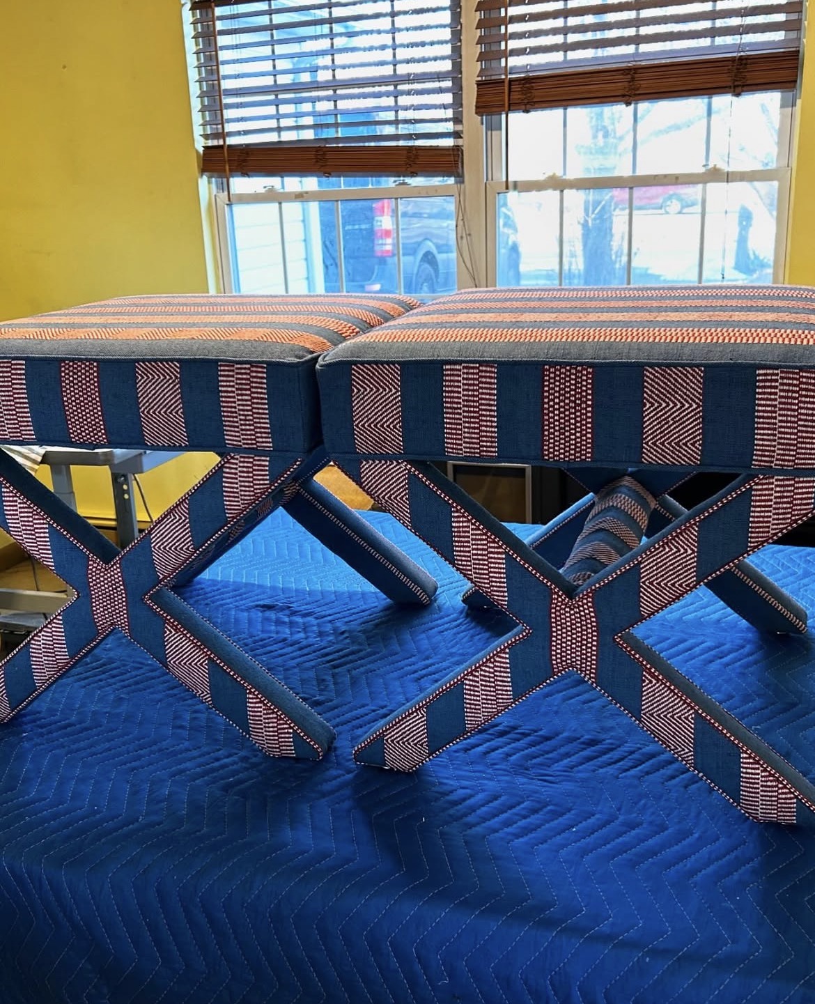 Finished pair of X-frame stools — matched ikat upholstery